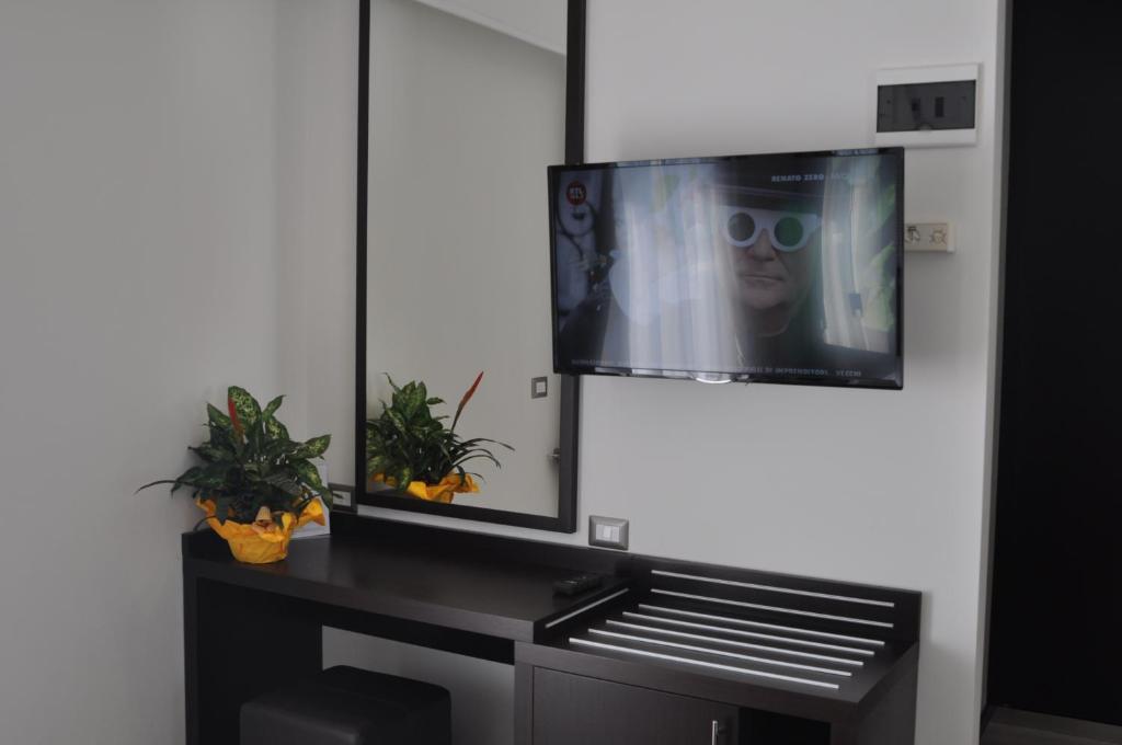 TV a/nebo společenská místnost v ubytování Hotel Adriatic&Beauty