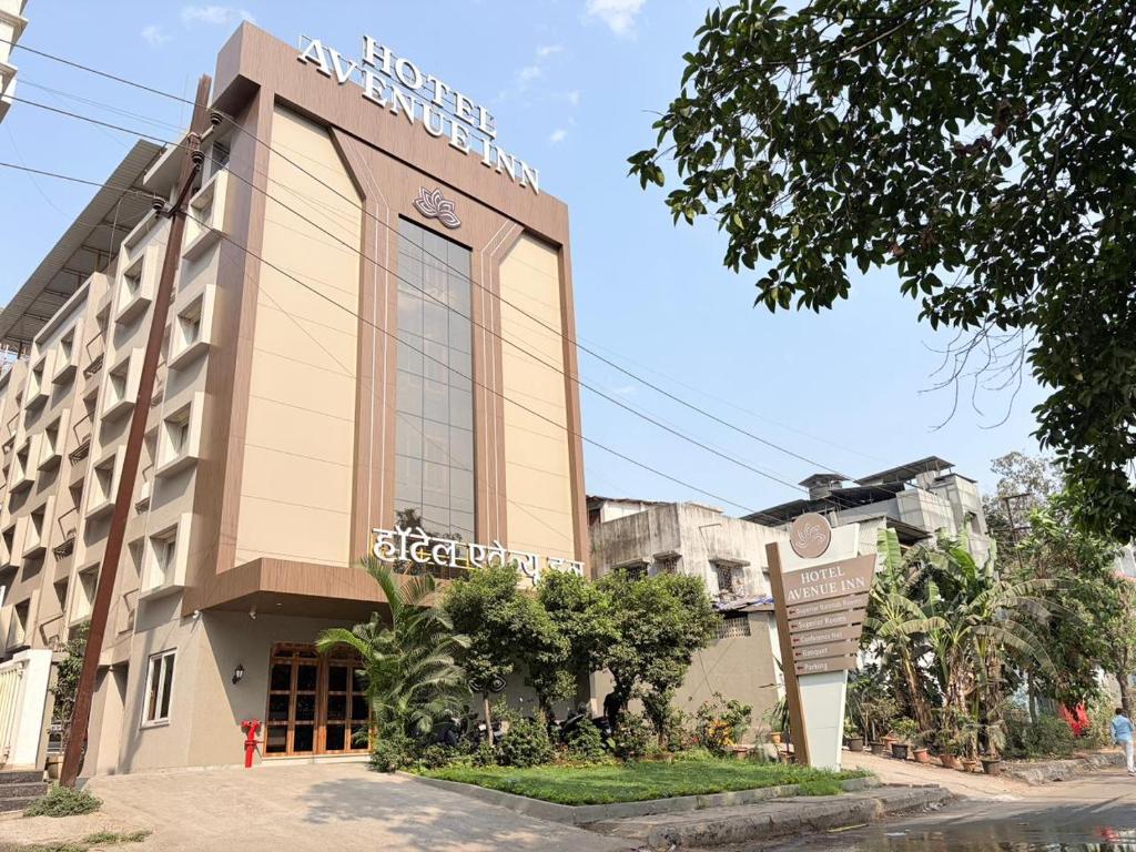 a building with a sign in front of it at Hotel Avenue Inn in Navi Mumbai