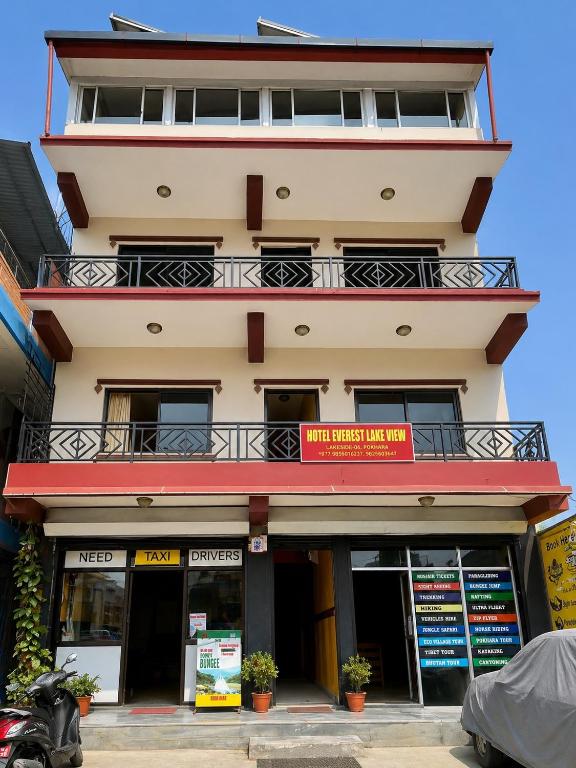 a building with a balcony on top of it at Hotel Everest Lake View in Pokhara