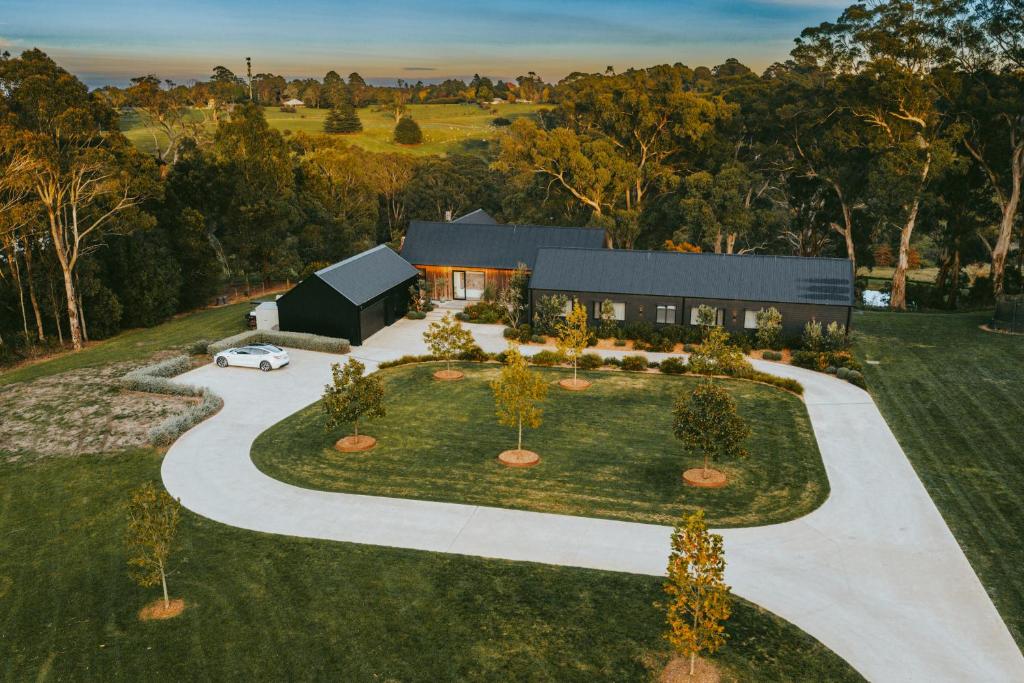 an aerial view of a house with a driveway at Injala House - Designer Masterpiece, Exeter in Exeter