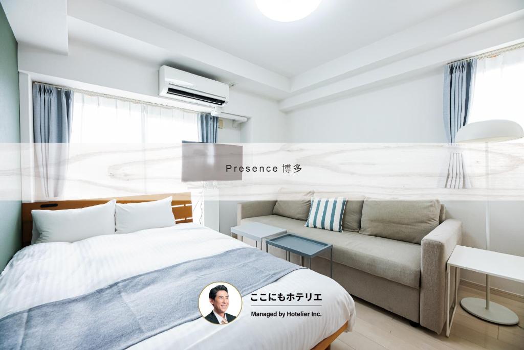 a hotel room with a bed and a couch at Presence Hakata in Fukuoka