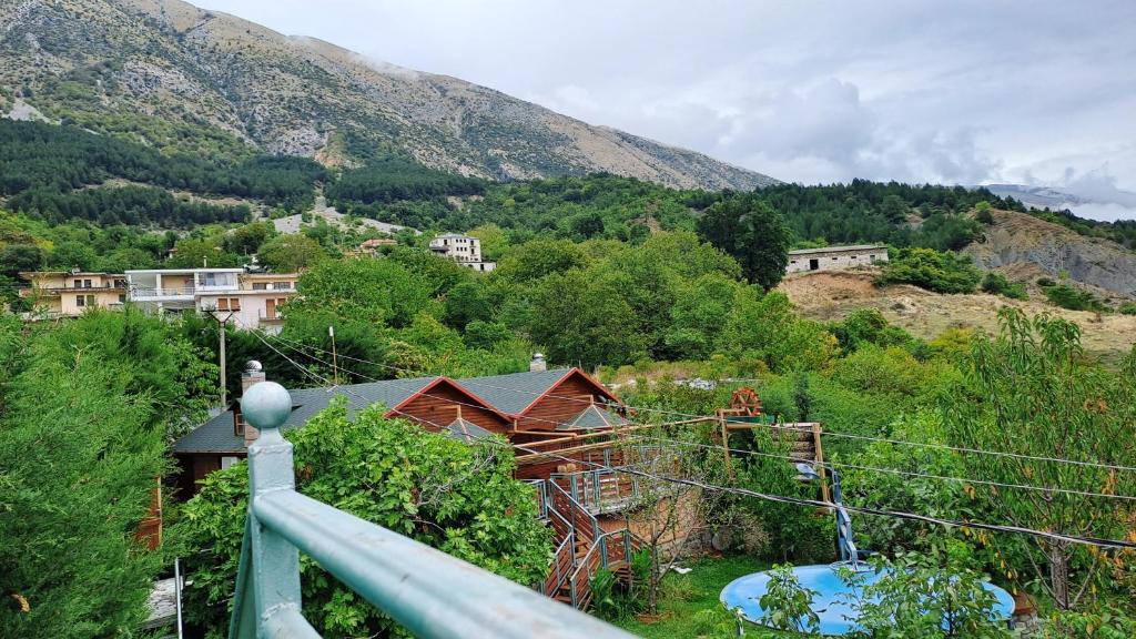 a view from the balcony of a house on a mountain at Bujtina Anesi in Poliçan