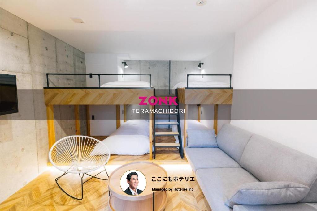 a living room with a couch and a bunk bed at ZONK HOTEL Haruyoshi-Teramachidori in Fukuoka