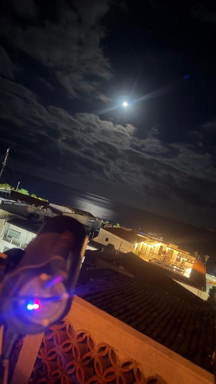 a moonlit view of a beach at night at Casa Portillo in Puerto Vallarta