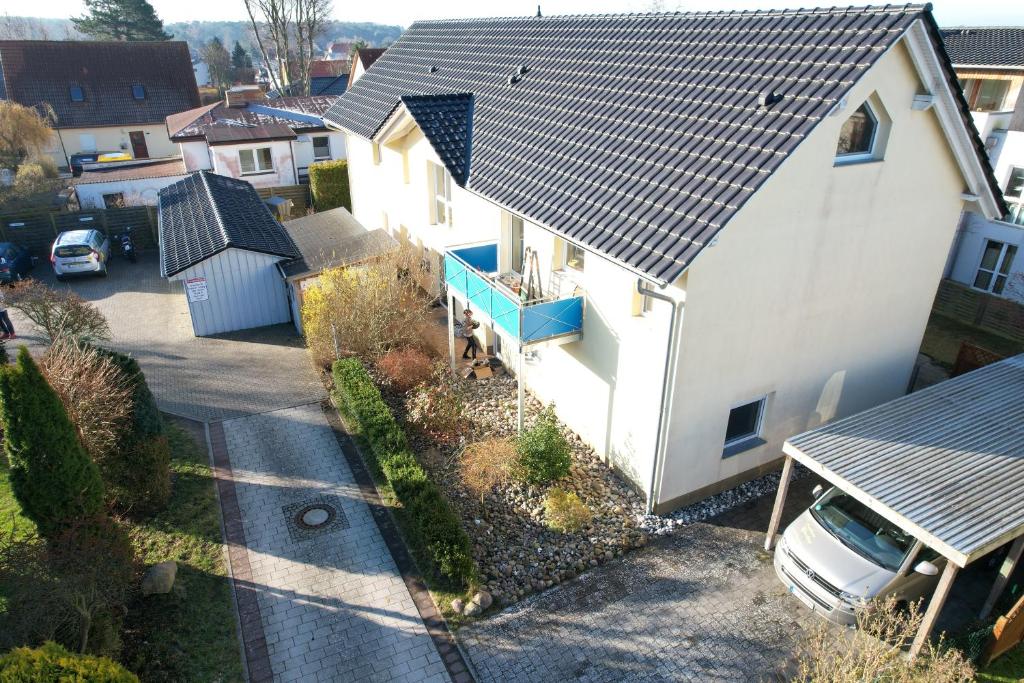 an overhead view of a white house with a roof at Windjammer in Koserow