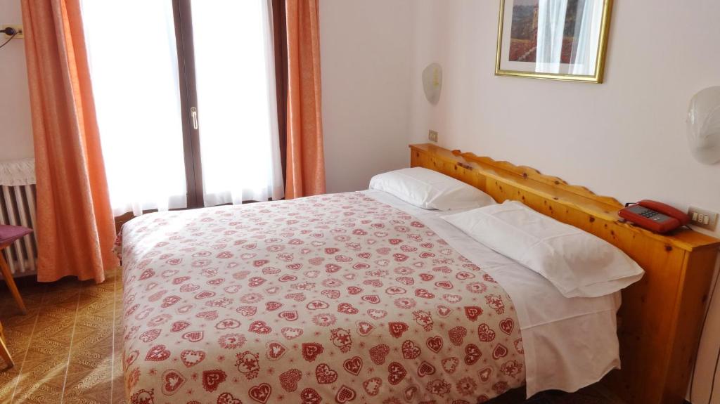 Posteľ alebo postele v izbe v ubytovaní Hotel Piccolo Mondo