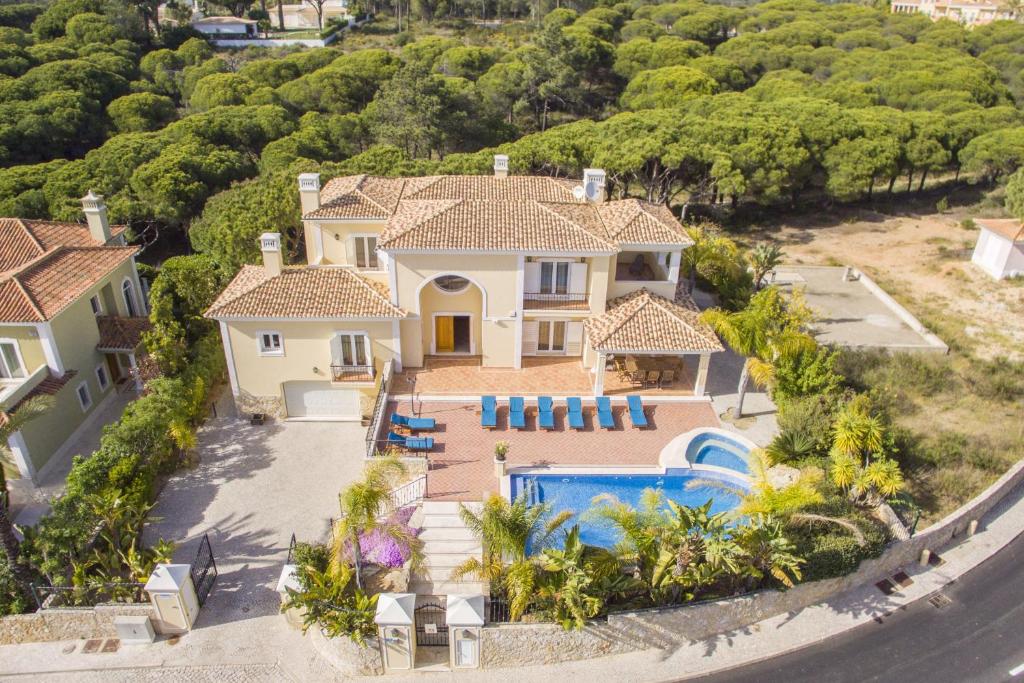 an aerial view of a house with a swimming pool at Villa Valentina by Algarve Holidays in Almancil