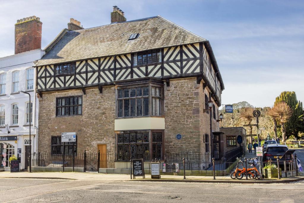 an old building on the corner of a street at Castle Lodge in Ludlow