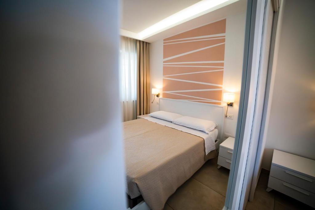 a small bedroom with a bed in a room at B&B MargAni Tropea in Tropea