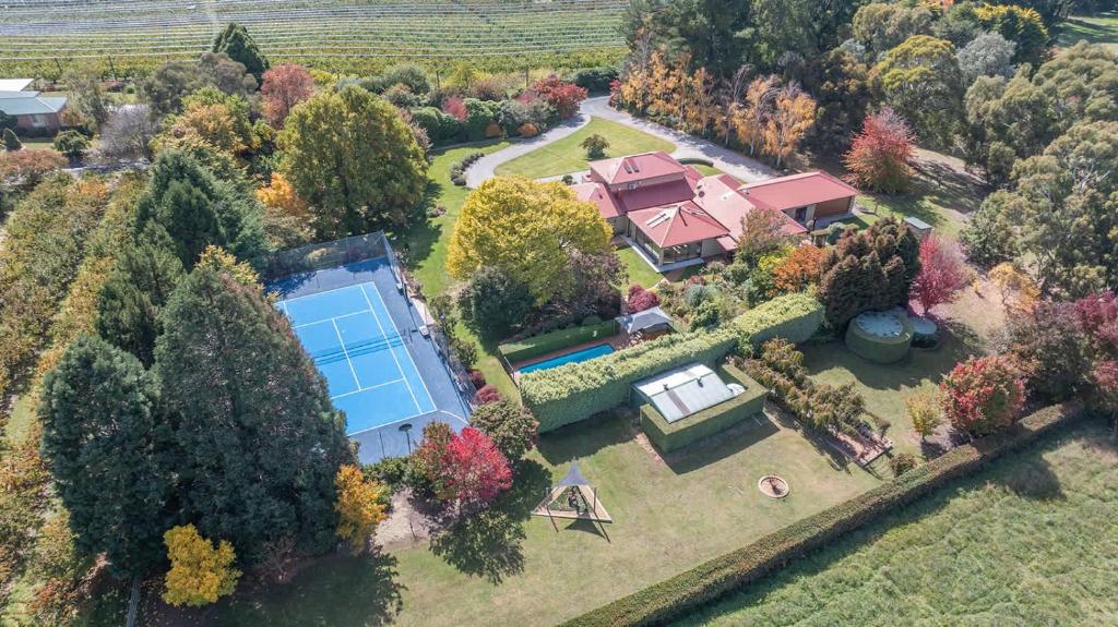 an aerial view of a house with a tennis court at Snowline - Ultimate Getaway, Pool, Spa & Tennis in Canobolas