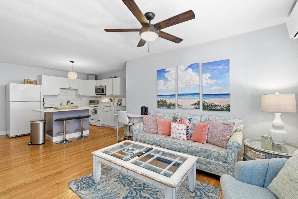 a living room with a couch and a table at Flagler Suites 3 in New Smyrna Beach