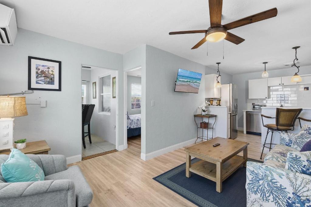 a living room with a couch and a table at Flagler Suites 2 in New Smyrna Beach