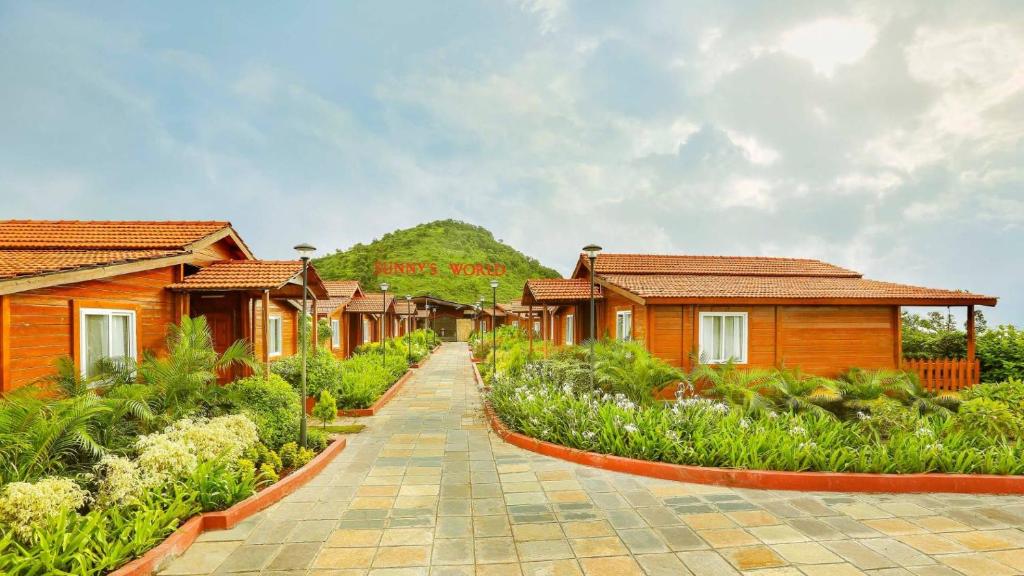 a row of cottages in a resort at Sunny's World Resort in Pune