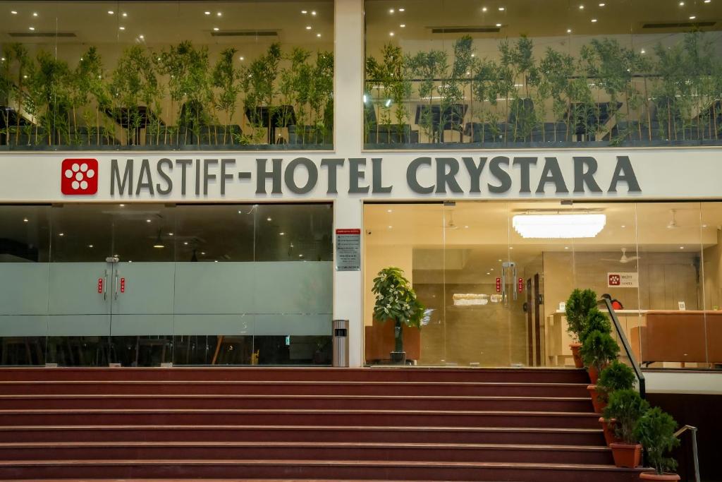 an airport building with a sign that readsmitchell hotel cyprus at Mastiff Hotel Crystara, Jalgaon in Jālgaon