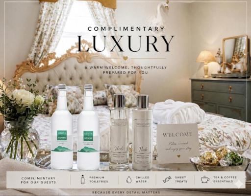 a display of complimentary luxury bottles on a bed at Elegant Georgian Grade II Listed House full of charm - 3 Super king rooms - 3 Mins for Safari Park & Steam Train - Parking in Bewdley