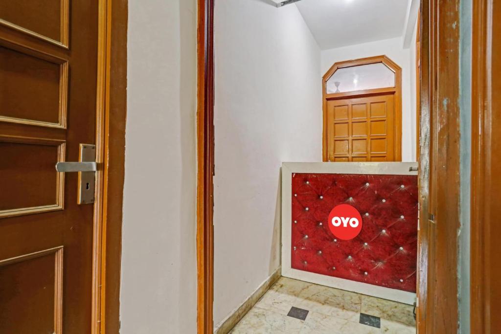 a door with a stop sign on a wall at Hotel O by OYO TSA in New Delhi