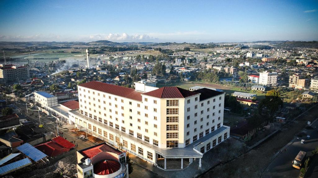 an overhead view of a large white building in a city at Haile Hotel Debre Birhan in Debre Birhan