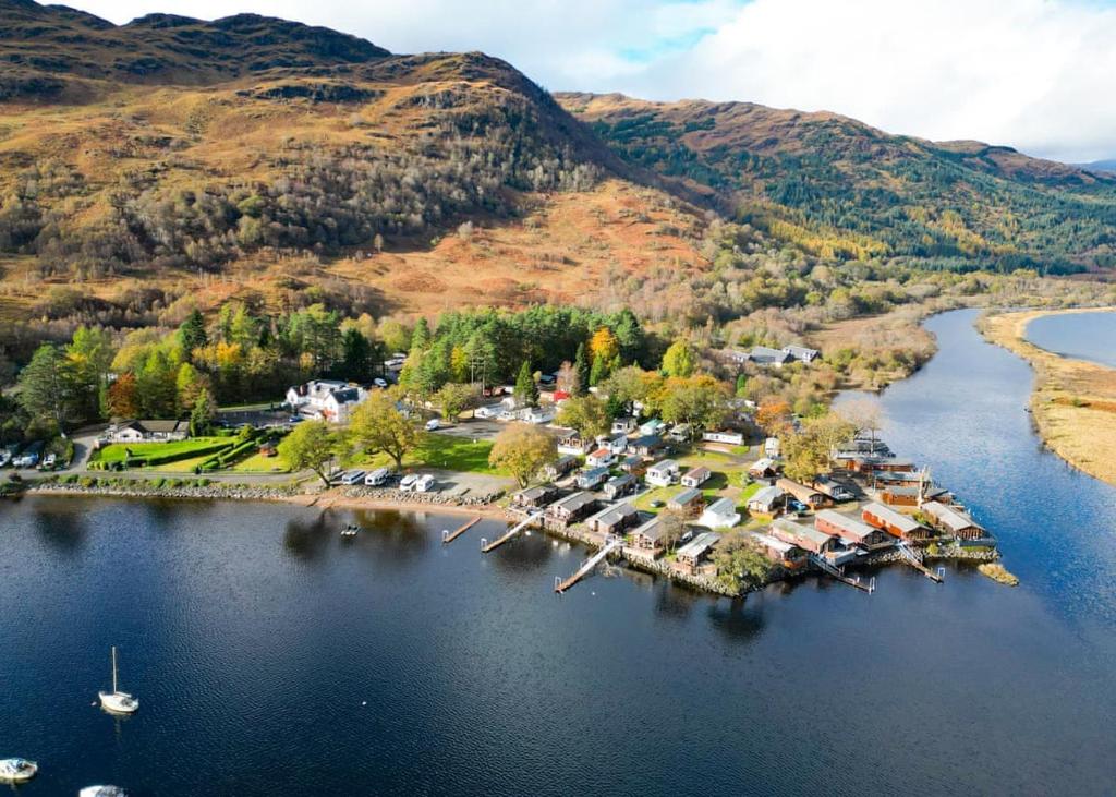 an aerial view of a small island in a lake at Ardlui Holiday Park in Arrochar