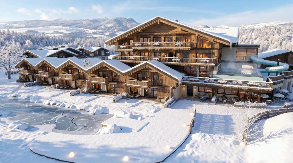 an aerial view of a lodge in the snow at Schiefergut Family Resort Flachau in Flachau