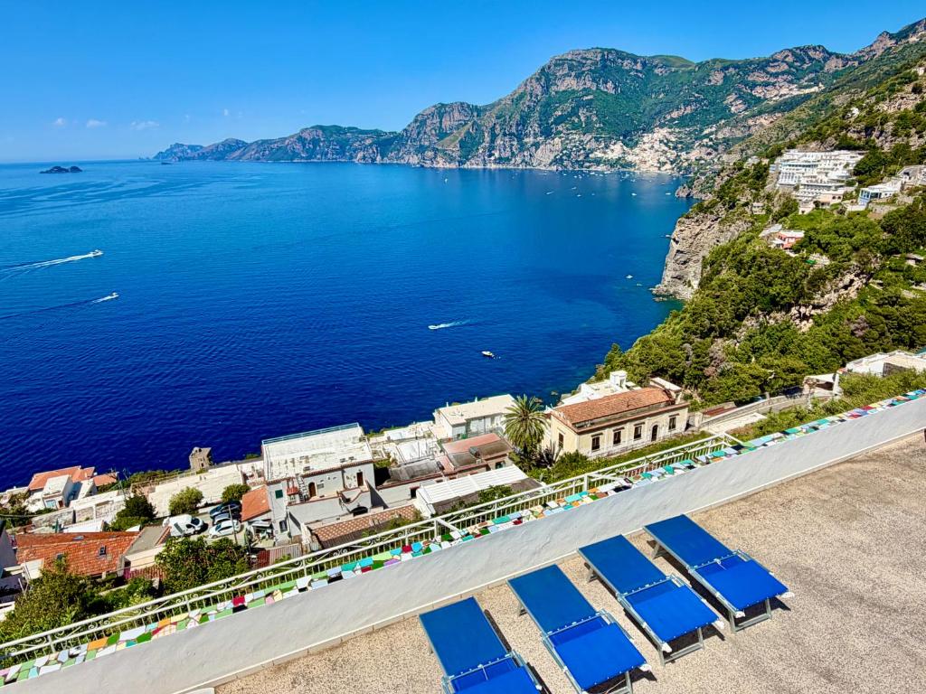 an aerial view of a town and a body of water at My Shazzy with amazing Sea View terrace in Praiano