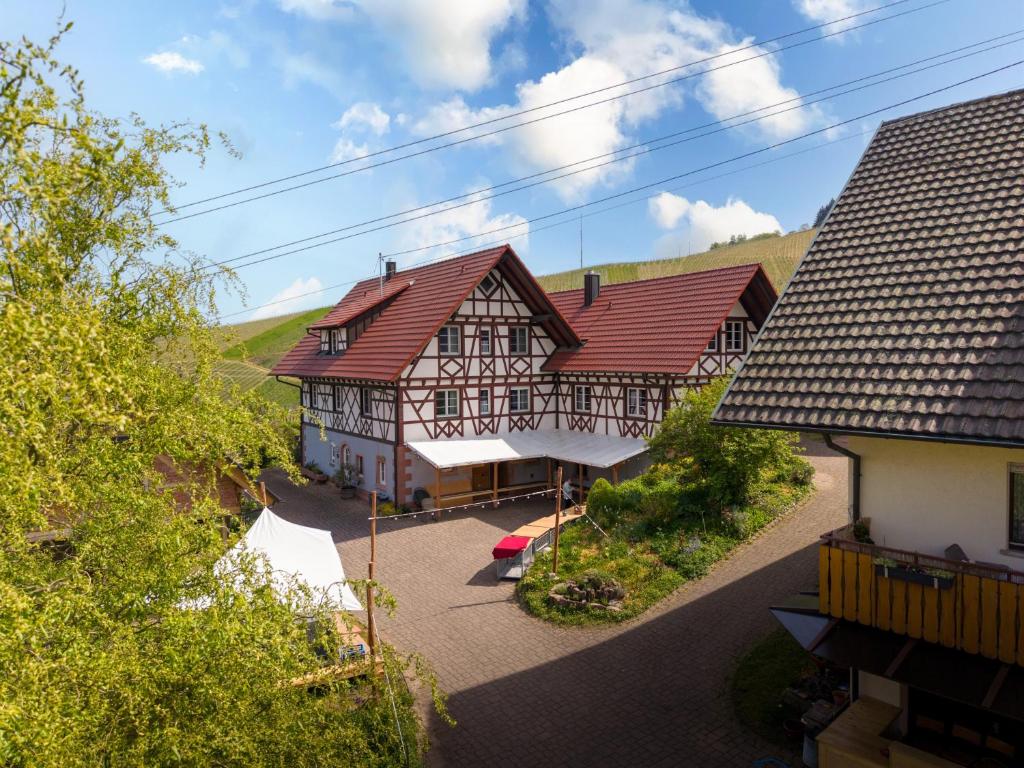an overhead view of a large building with red roofs at Ferienwohnung Gartengeschoss in Durbach