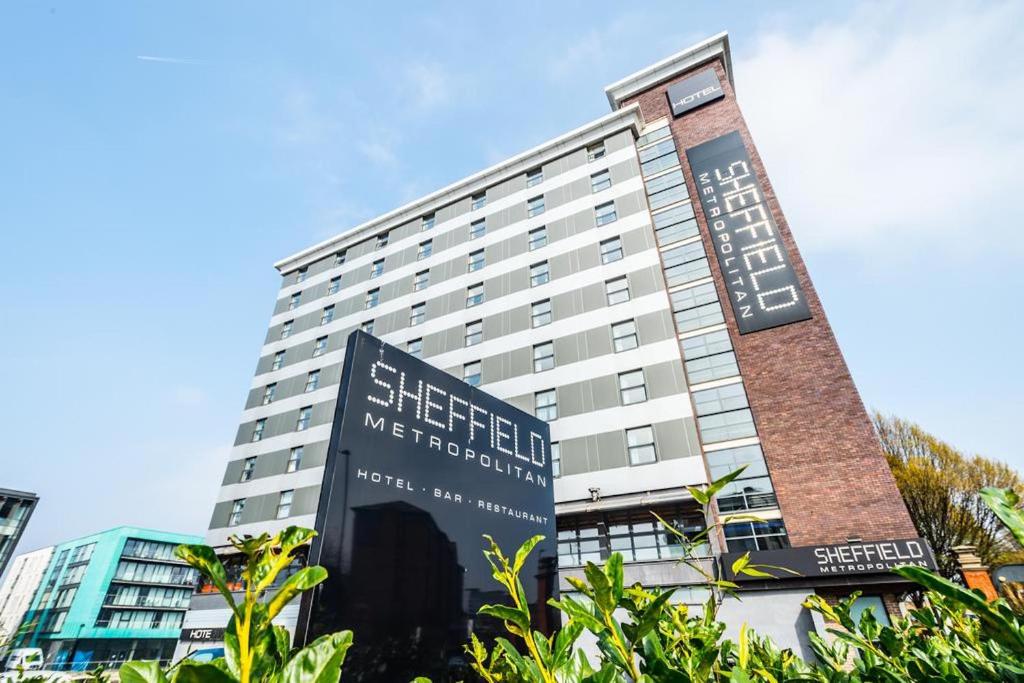 a large building with a sign in front of it at Sheffield Metropolitan Hotel by Belvilla in Sheffield