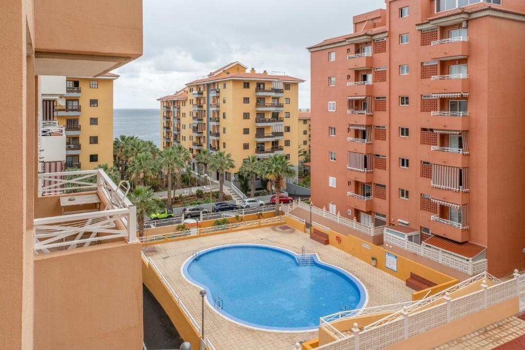 a view from the balcony of a apartment with a swimming pool at Brisa Caletillas in Punta Larga