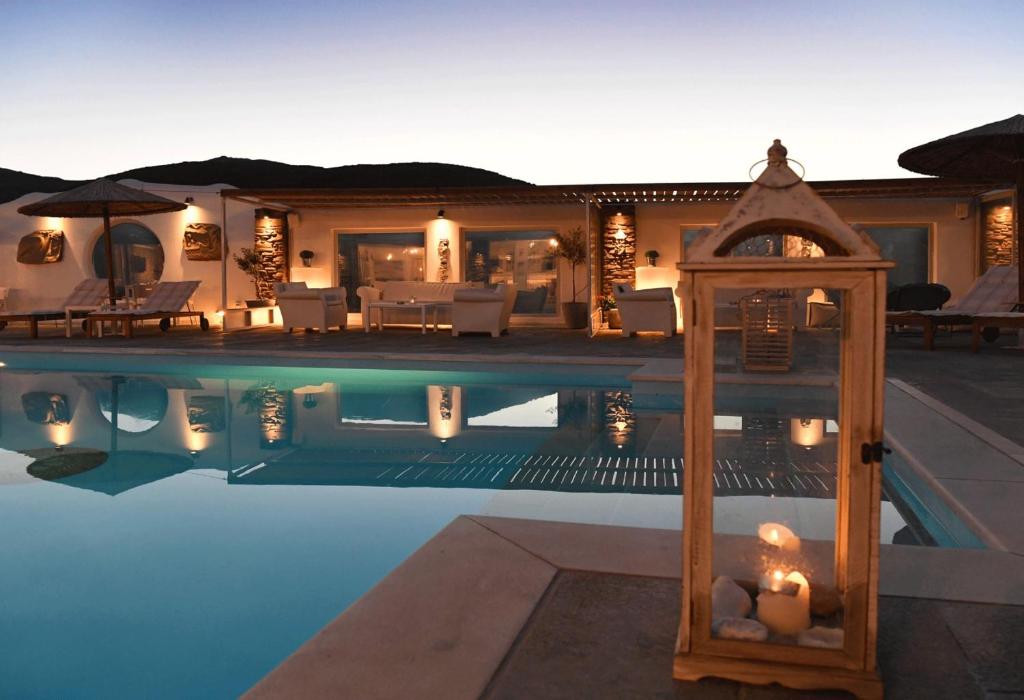 a villa with a swimming pool and a house at GLAFKY Retreat in Panormos