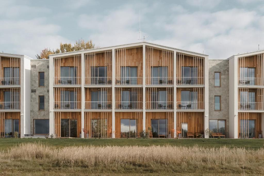 an external view of a building with windows at MARSHALL Golf & Wellness Hotel in Sokolov