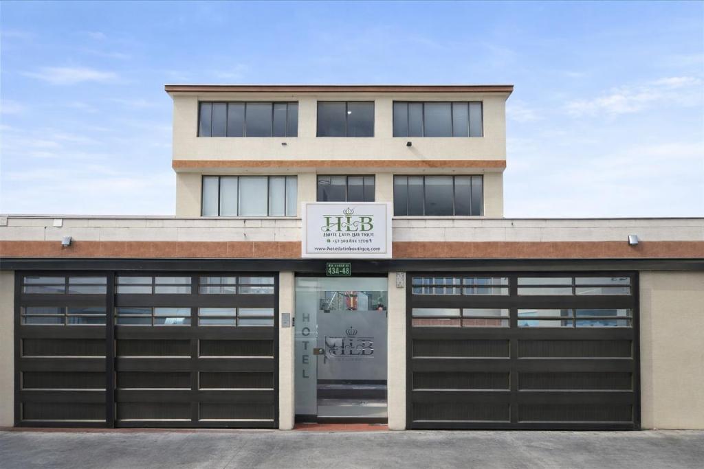 a building with two garage doors in front of it at Latín Boutique in Bogotá