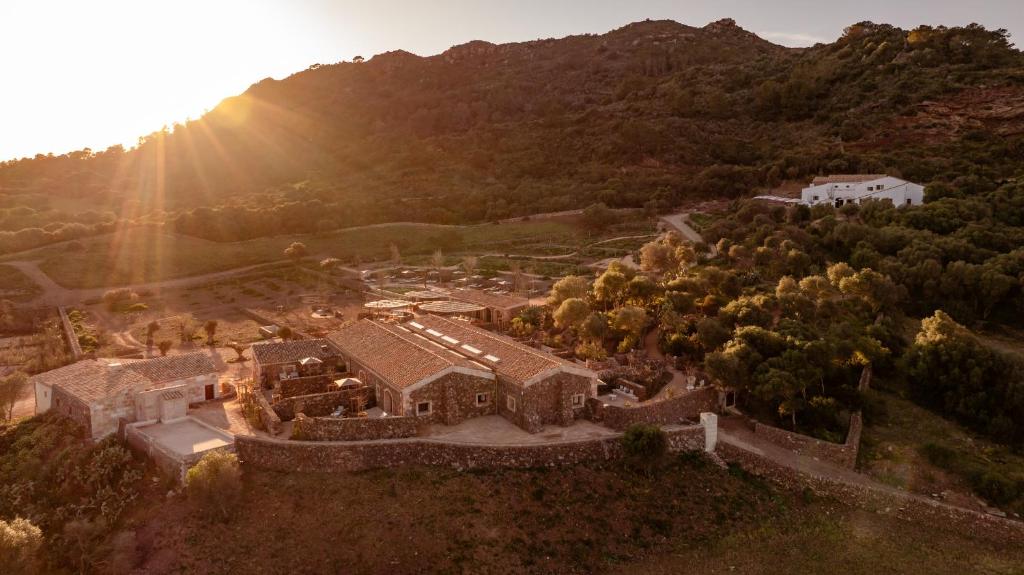 an aerial view of a house in a mountain at Hotel Vestige Binidufà in Isla de Menorca