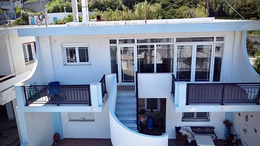 an aerial view of a house with balconies at Meltemi Evia in Paralía