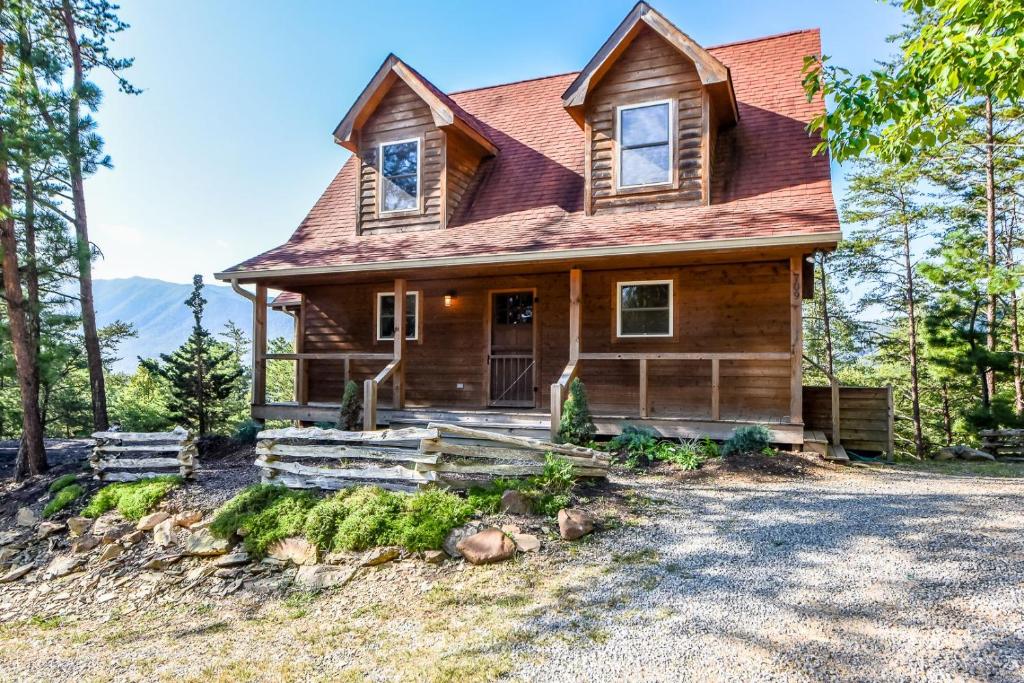 a wooden house with a red roof at Above It All in Townsend