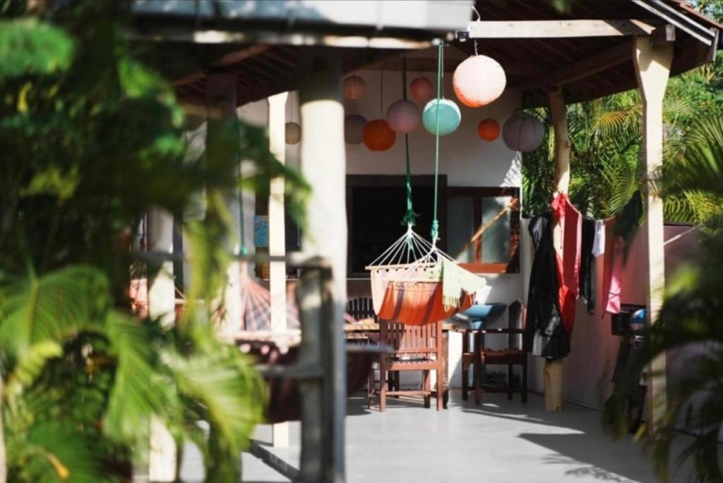a porch with a bunch of balloons hanging from it at Romance in Bay in Arugam Bay