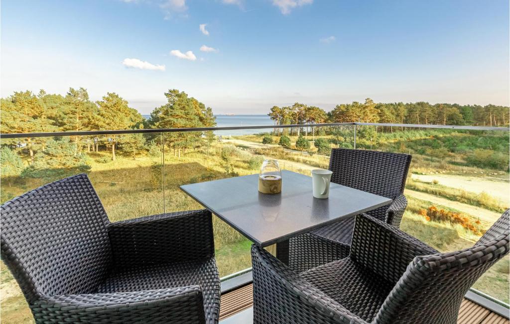 a table and chairs on a balcony with a view at Princess in Binz