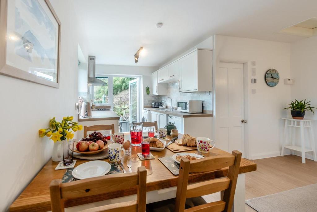 a kitchen and dining room with a table and chairs at 2 Bed in Berrynarbor oc-l34468 in Berrynarbor