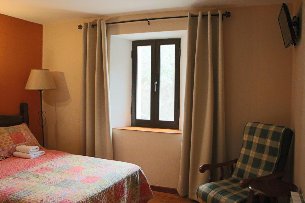 Cama o camas de una habitación en Hotel Moto-Rural "VEGALION"