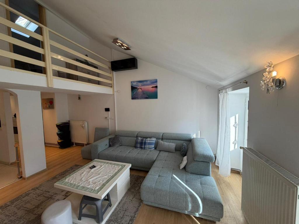 a living room with a couch and a table at Seafront Apartment Bakar in Bakar