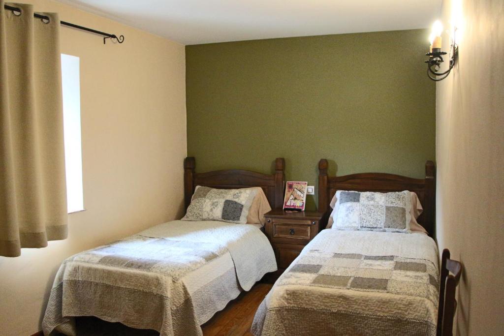 Cama o camas de una habitación en Hotel Moto-Rural "VEGALION"