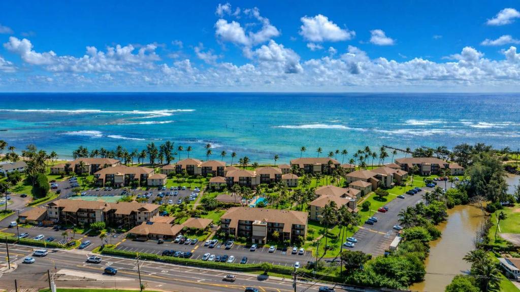 an aerial view of a resort near the ocean at 2 Bedroom OceanView Condo Pono Kai Resort E103 in Kapaa