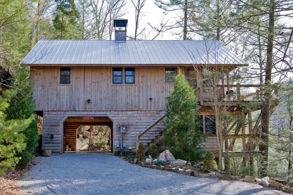 a large wooden barn with a garage at Hayloft in Townsend