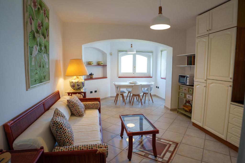 a living room with a couch and a table at L'Appartamentino in Casa Donato