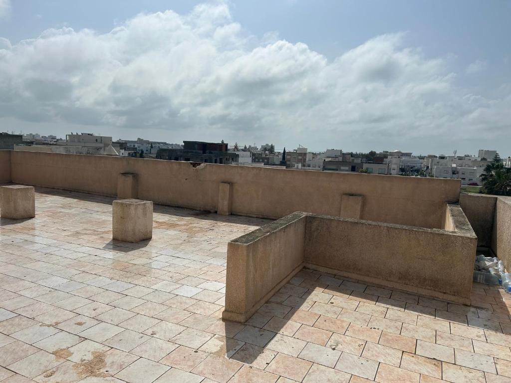 a view of a city from the roof of a building at Appartement du bonheur in Nabeul