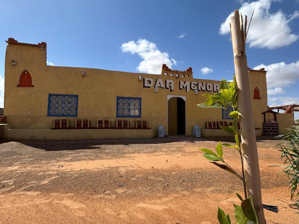 a building with a sign that reads bar network at Riad dar merzouga in Merzouga