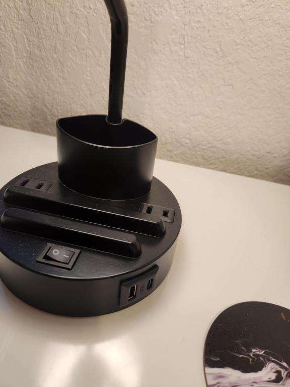 a black router sitting on top of a table at Comfy hideaway in Hollywood