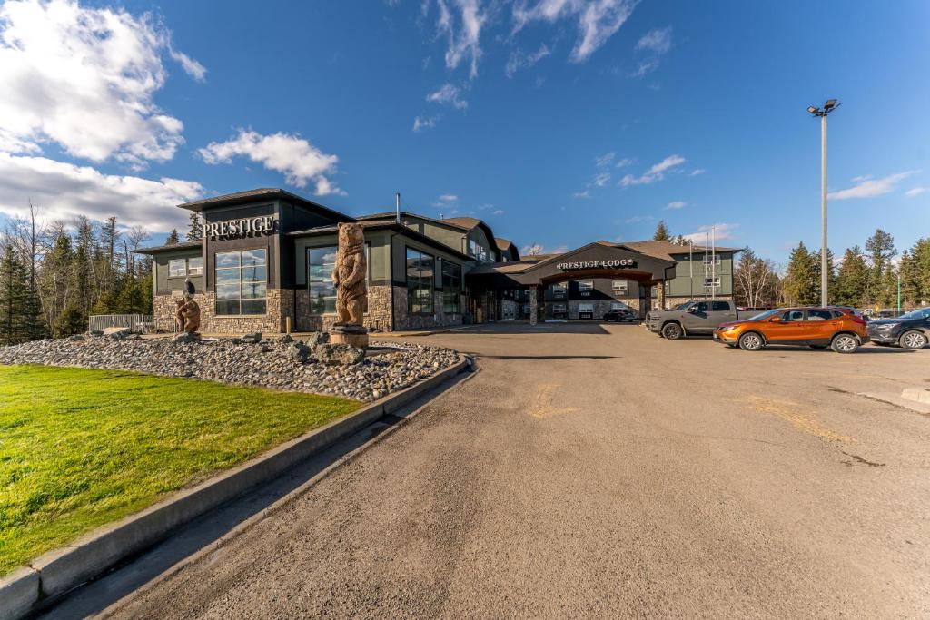 a parking lot in front of a building at Prestige Prince George Lodge in Prince George