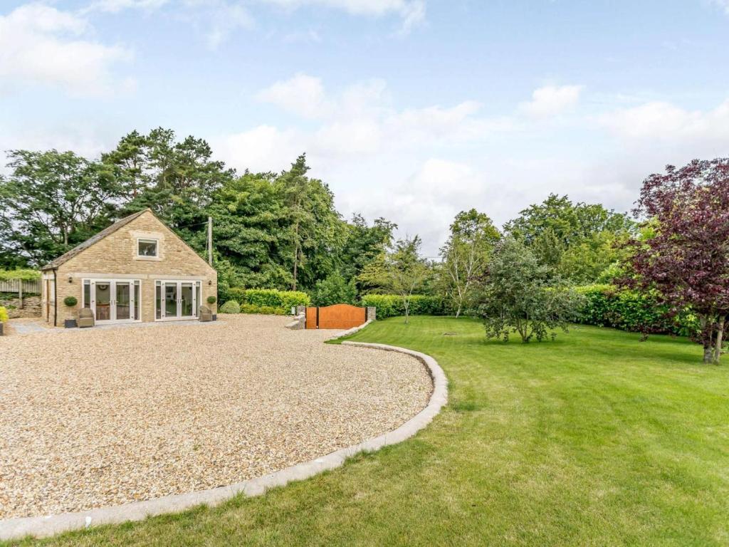 a large yard with a house and a gravel driveway at 1 Bed in Corsham oc-83690 in Box