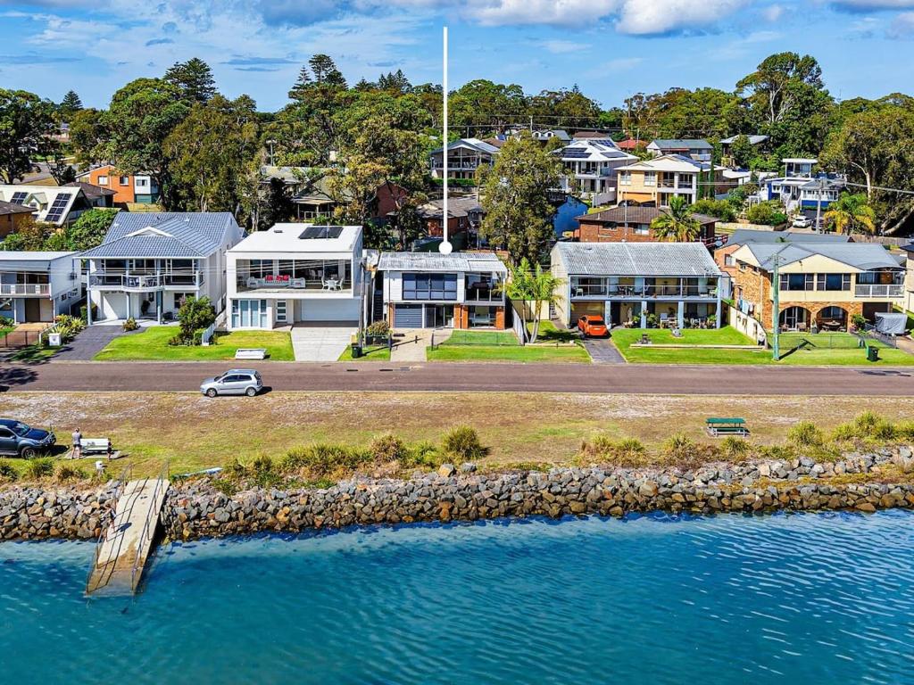 an aerial view of a house next to the water at Bayview Nook Tanilba Bay in Lemon Tree Passage