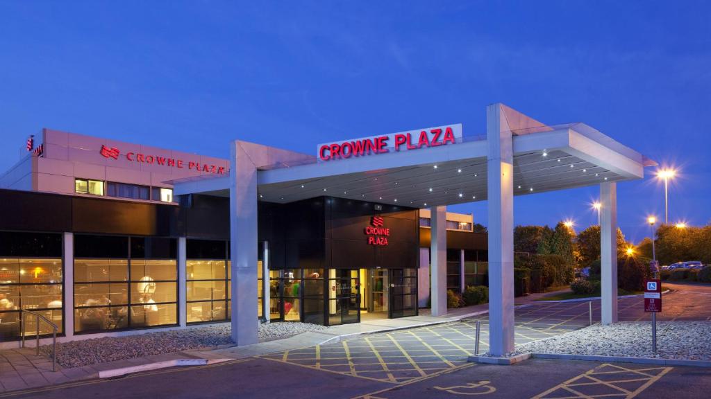 a building with a sign that reads creatine pka at Crowne Plaza Manchester Airport by IHG in Manchester Airport