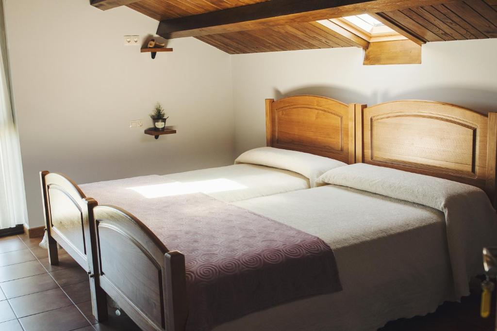 a bedroom with two beds in a room at Albergue Camino Norte in Castropol